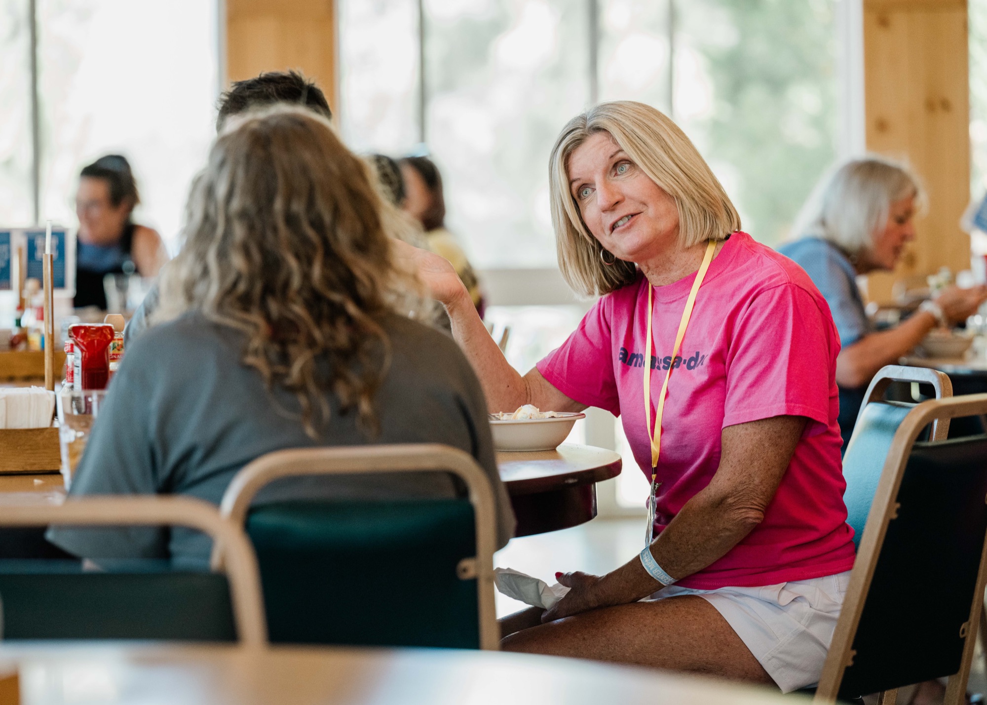 A Reformation Project ambassador listening during a conversation at the 2026 retreat