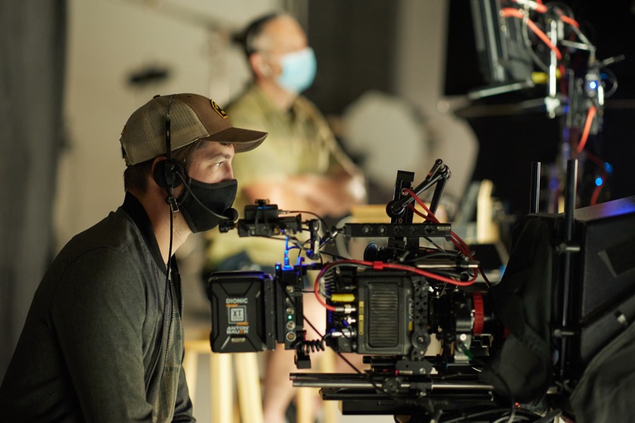 A camera operator on set